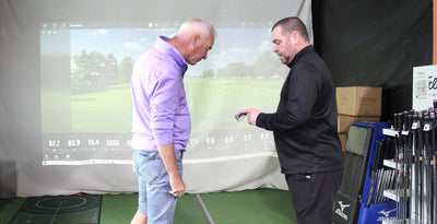 What happens during a custom golf club fitting?